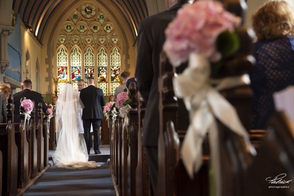 bride and groom at altar