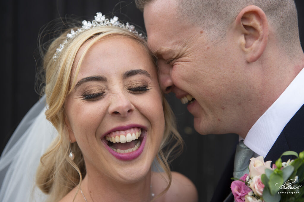 bride laughing, groom laughing