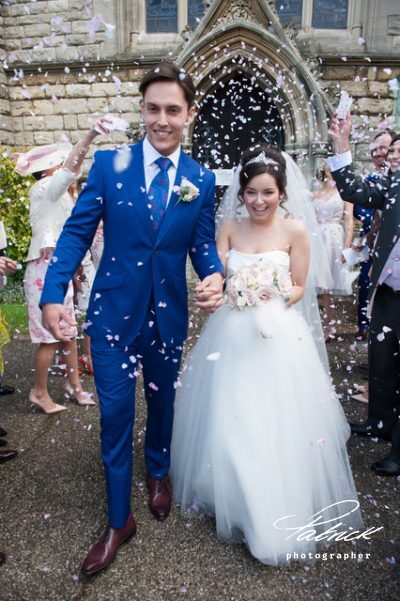 confetti shot bride and groom leaving church