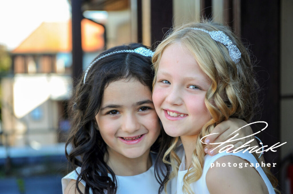 young bridesmaid smiling directly at camera