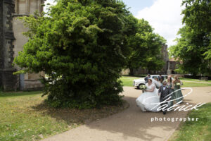 st albans abbey, cathedral, bride, father of the bride, white car, wedding party, approach catherdral