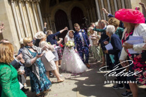 st albans abbey, bride, groom, confetti, wedding party, happy, cheering,