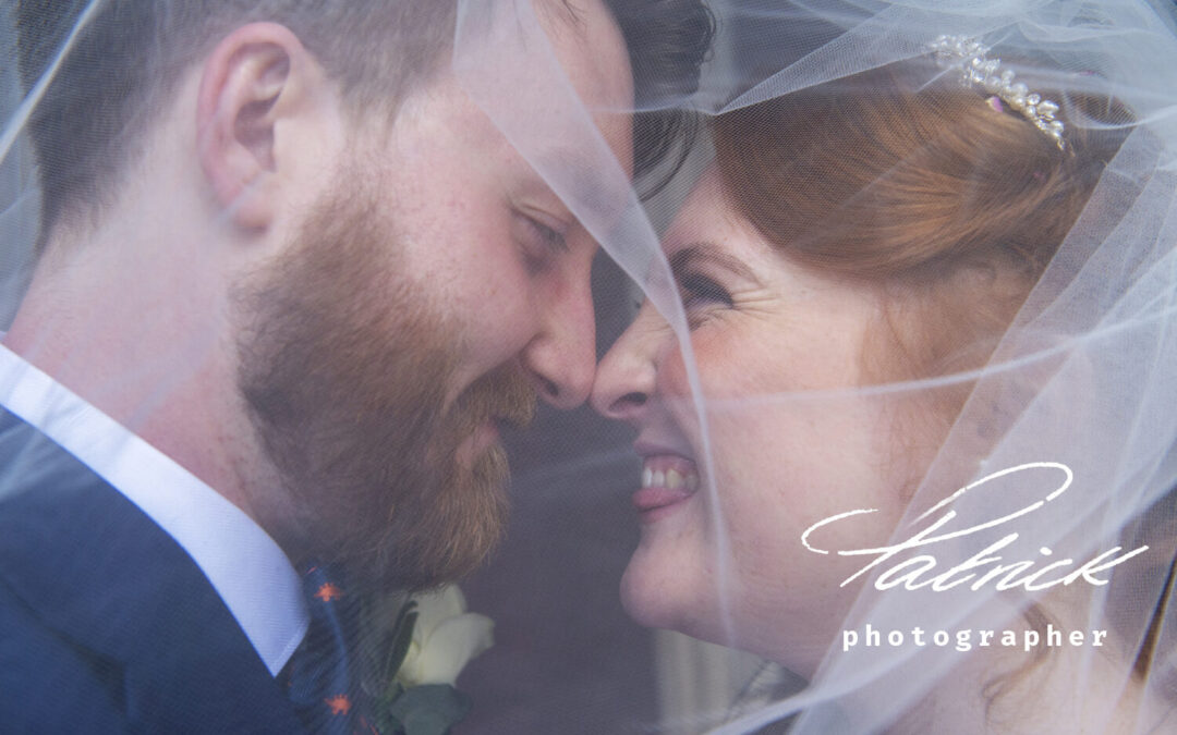 bride red hair, groom beard, pull faces, under veil, close up