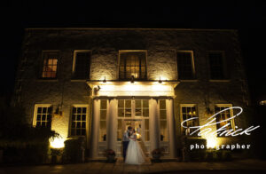 lit up, night shot, exterior, front, st michael's manor, bride and groom, door