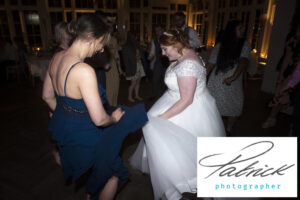 bride dances with friend, night shot