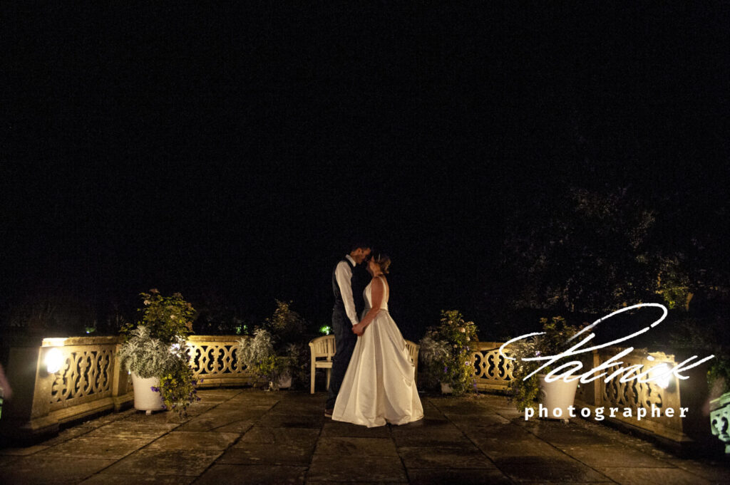 lanwades hall terrace bride and groom night dark lit patio