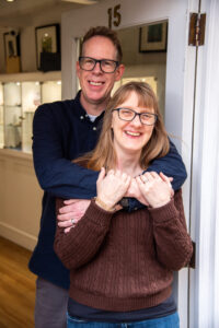 Owners Jackie and Andy of Chapter 79, standing in the doorway of their Hertford Jewellery Shop