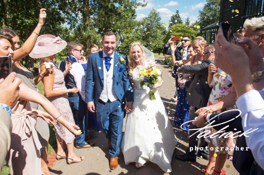 Essendon country club bride and group and guests confetti sunny day happy