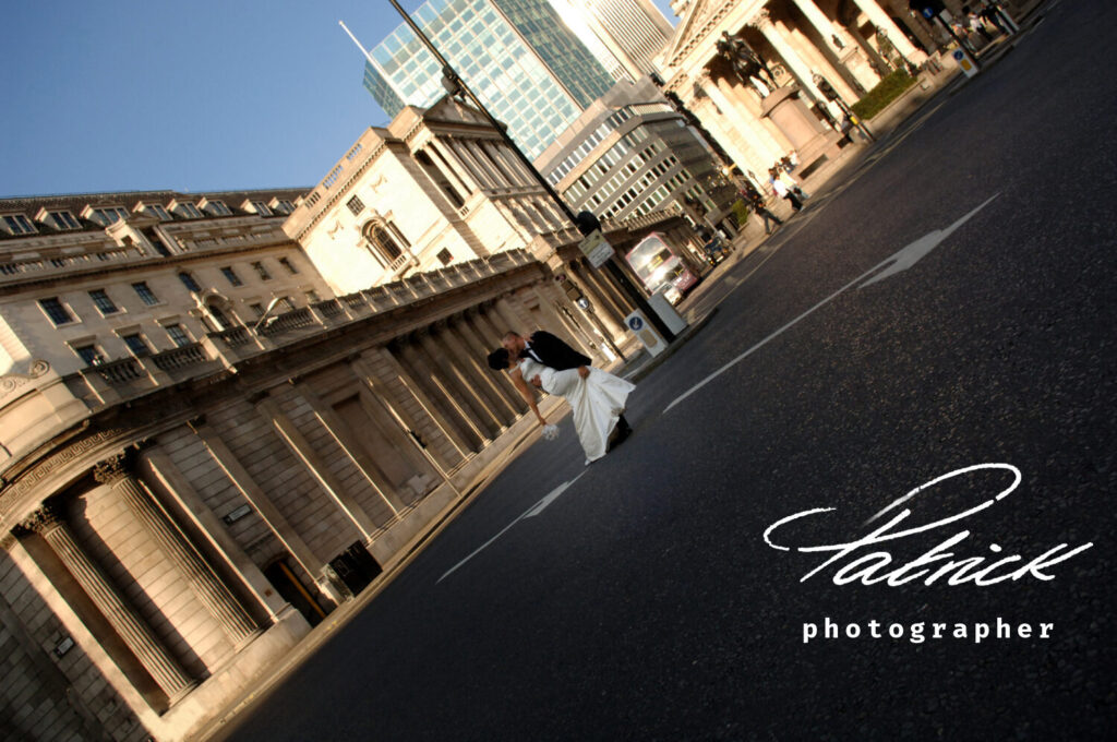 bank London bride and groom at crossing no traffic in the middle of the road