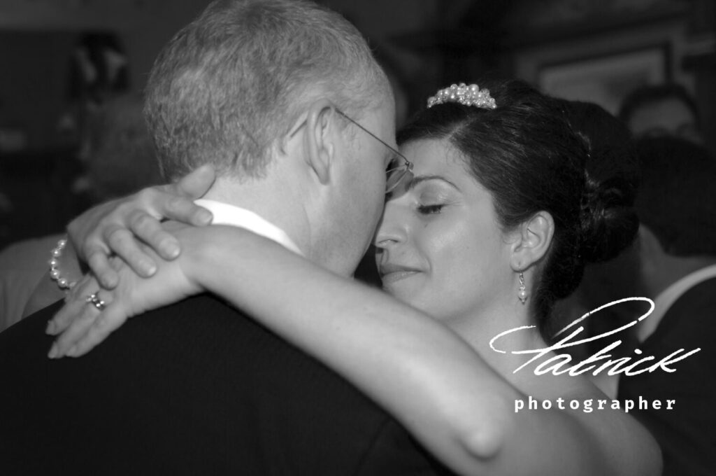 bride and groom close up dancing shot black and white, university arms building