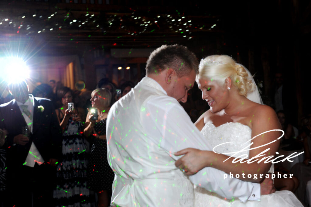 bride and groom dance, brides dad looks on, atmospheric lighting, tewinbury hotel, night