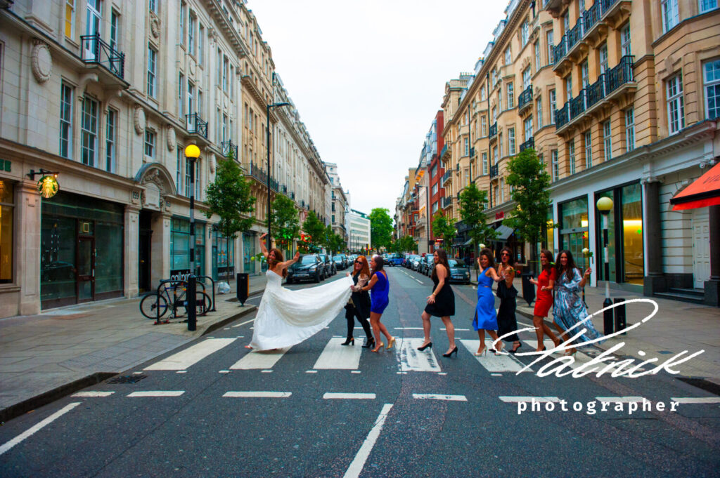 London street, zebra crossing, shops, daytime, bride and her girlfriend crossing jewish wedding