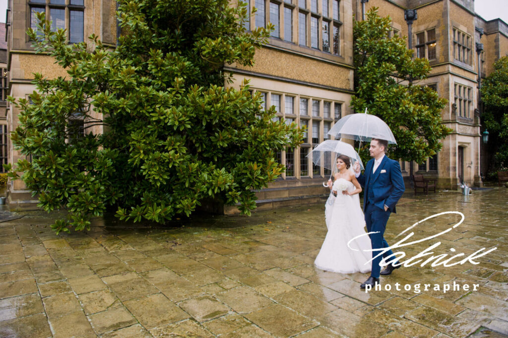 rainy wedding day, umbrellas, bride and groom, stately ware fanhams hall, trees, wet grounds