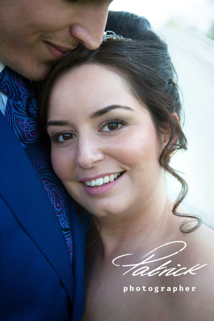 groom and bride close up his side face she looking at camera ringlets