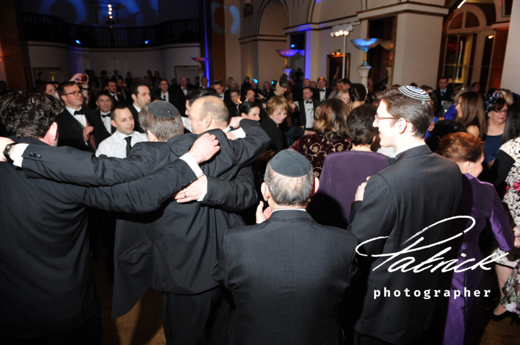 jewish, men, dancing,wedding. Villandry, interior, backs to camera