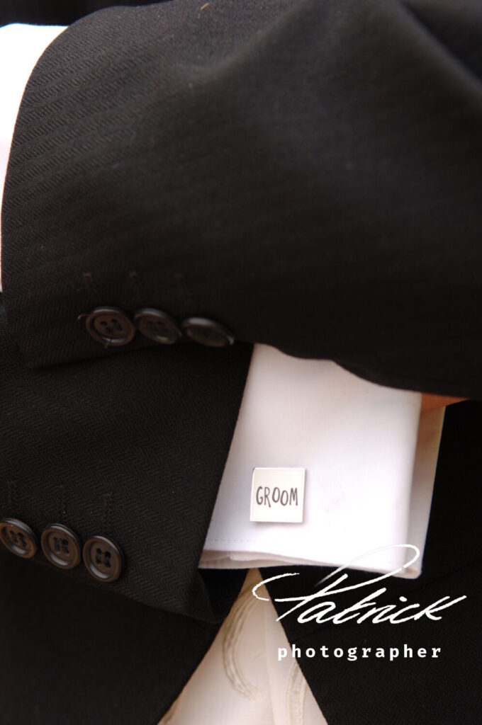 groom cufflink worn white shirt, black jacket