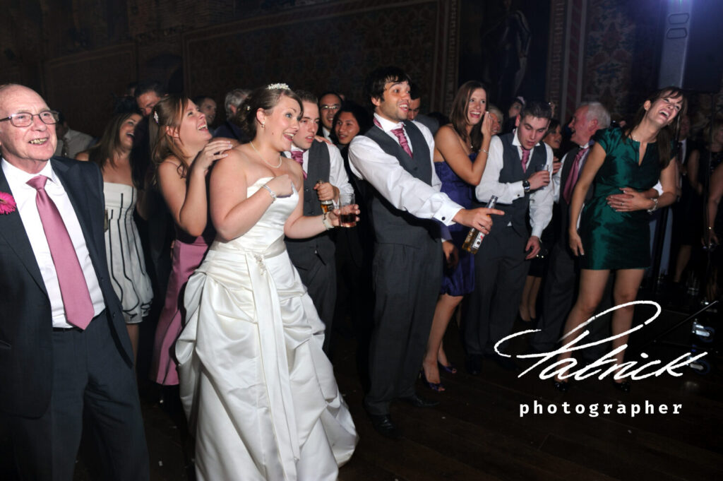 happy and engaged wedding guests watching the entertainment