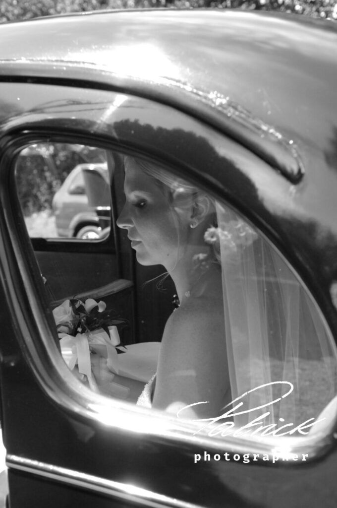 bride arriving, in back of car, anticipation, black and white image