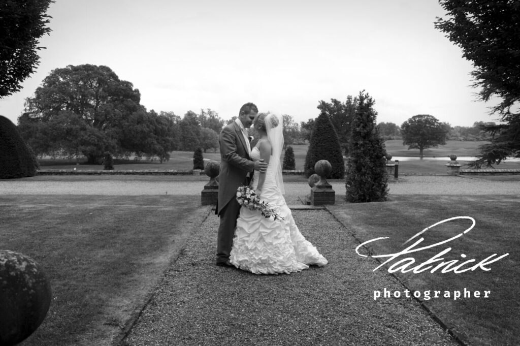 bride and groom hanbury manor grounds black and white