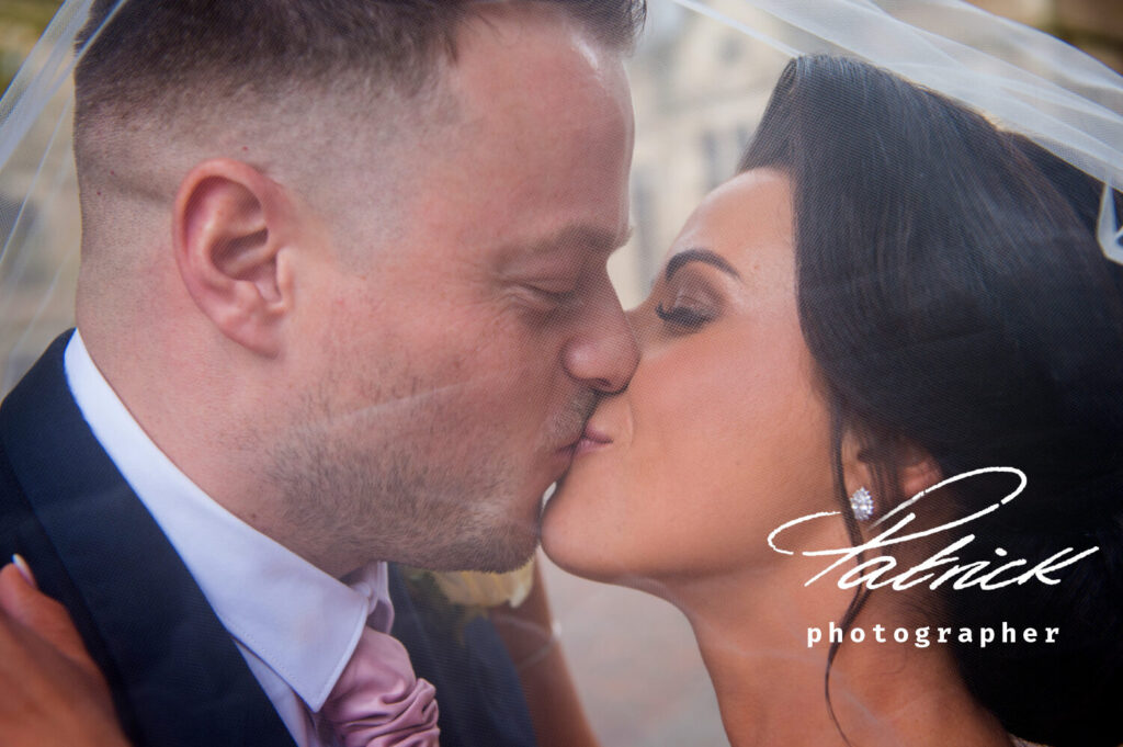 close up, kissing under veil, at fanhams hall wedding venue