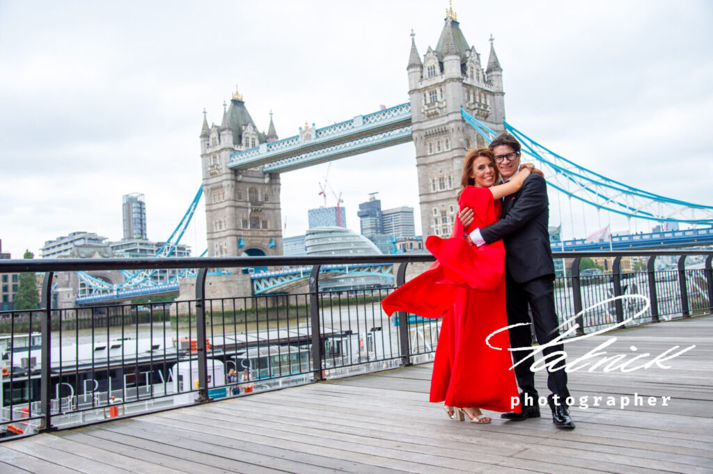 bride wears red, groom hugs bride, tower bride London