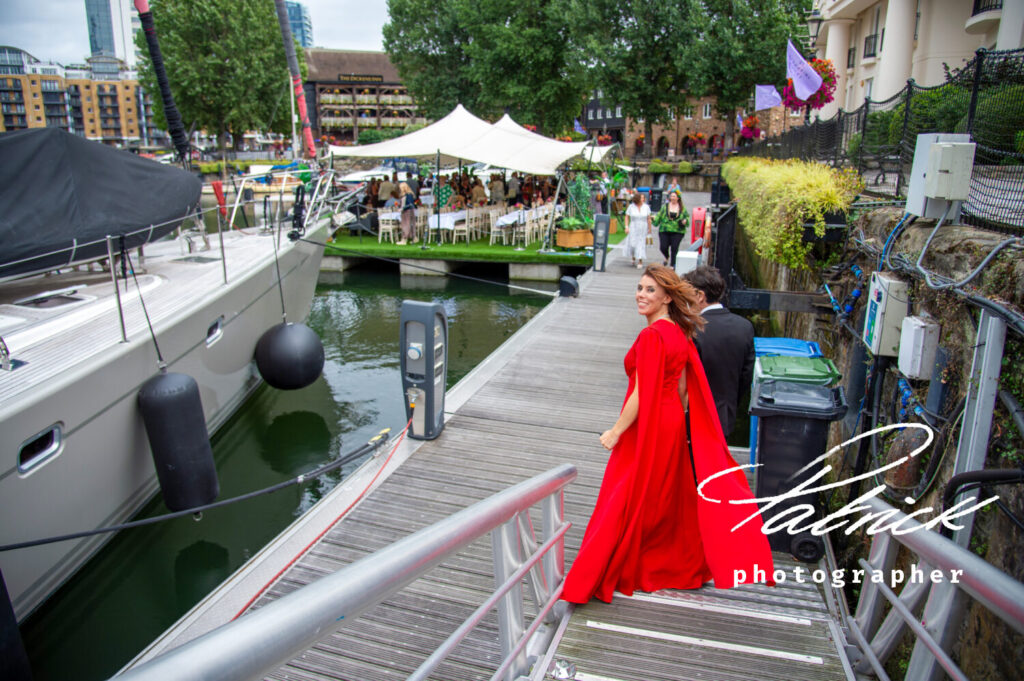 st katharine docks London bride and groom walking down to floating marquee