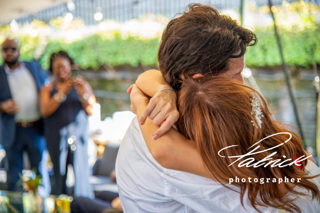 st katharine docks bride hugs her husband first dance onlookers