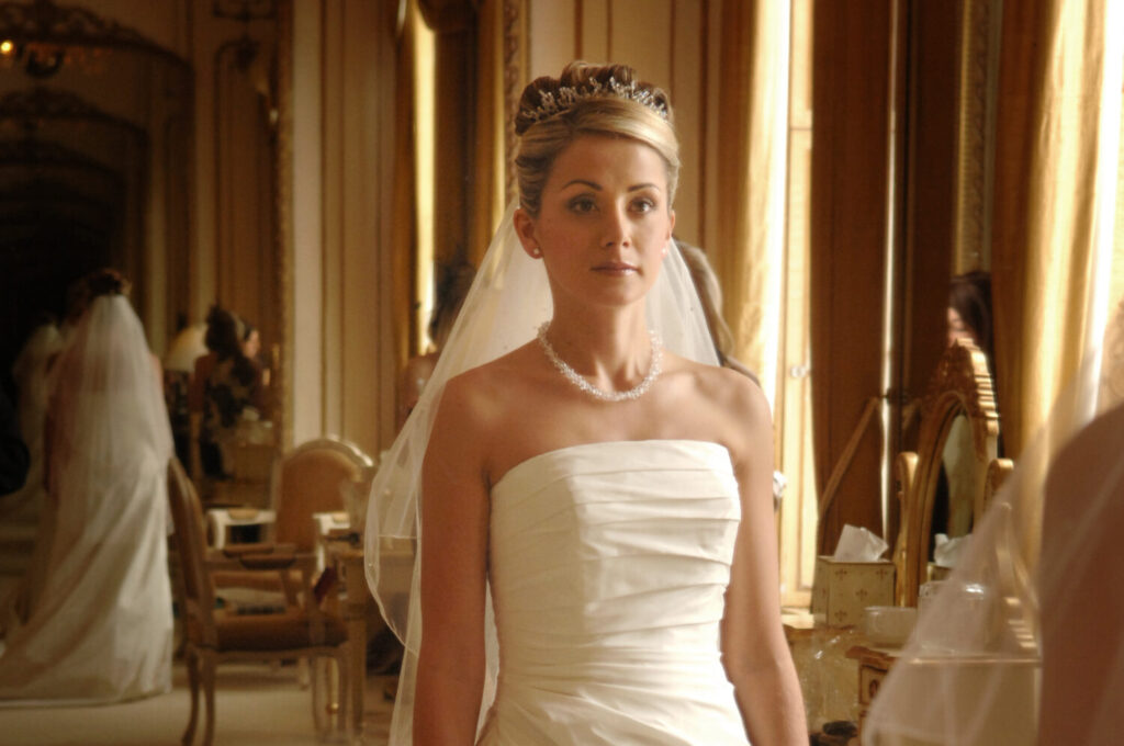 bride, bridal prep, ready, looking at camera, pensive, white dress, veil, blonde, pearl necklace