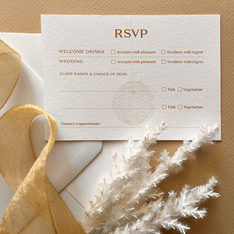 close up of decor and sample wedding invitation