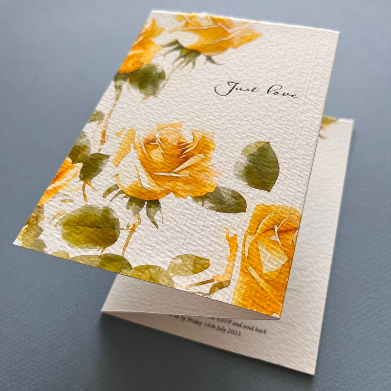close up of Just Love card, yellow roses and green leaves