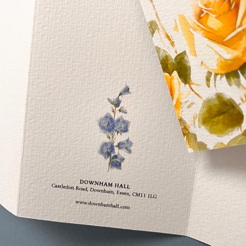 close up of flower watercolour with the venue name printed beneath