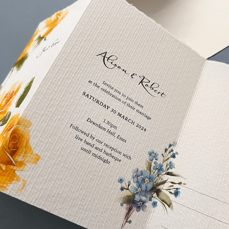 close up of middle fold revealing wedding detail alison and rob