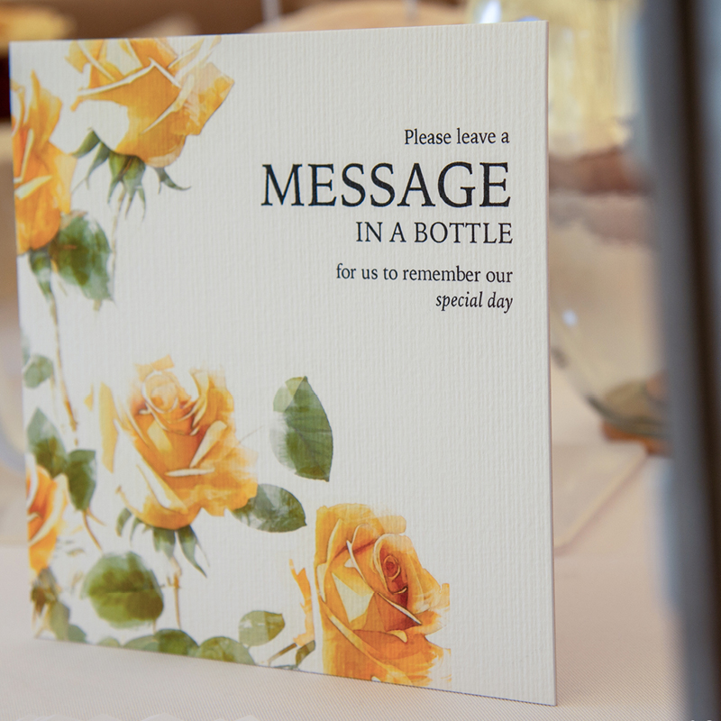 close up of wedding stationery Message in a bottle message