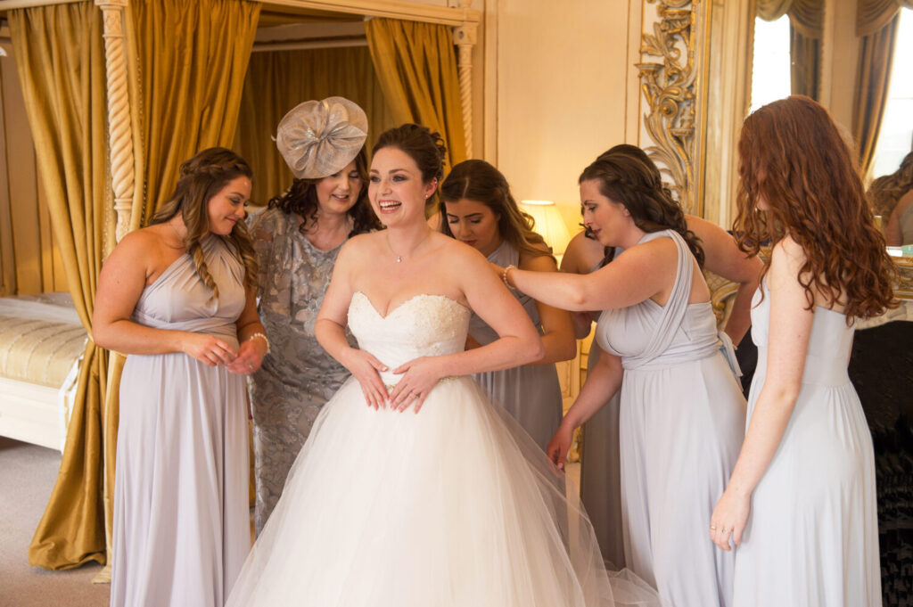 bride attended by bridesmaids, getting ready, bridal suite, bridal prep