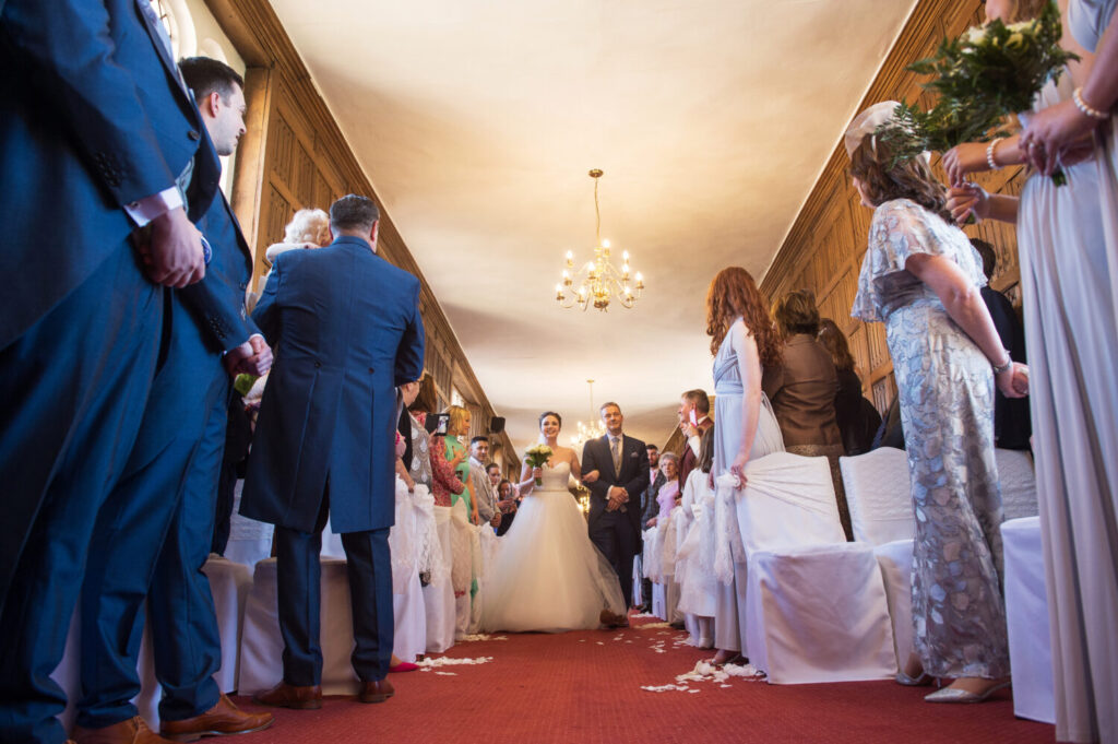 bride and groom leaving the wedding aisle after wedding ceremony, low camera angle