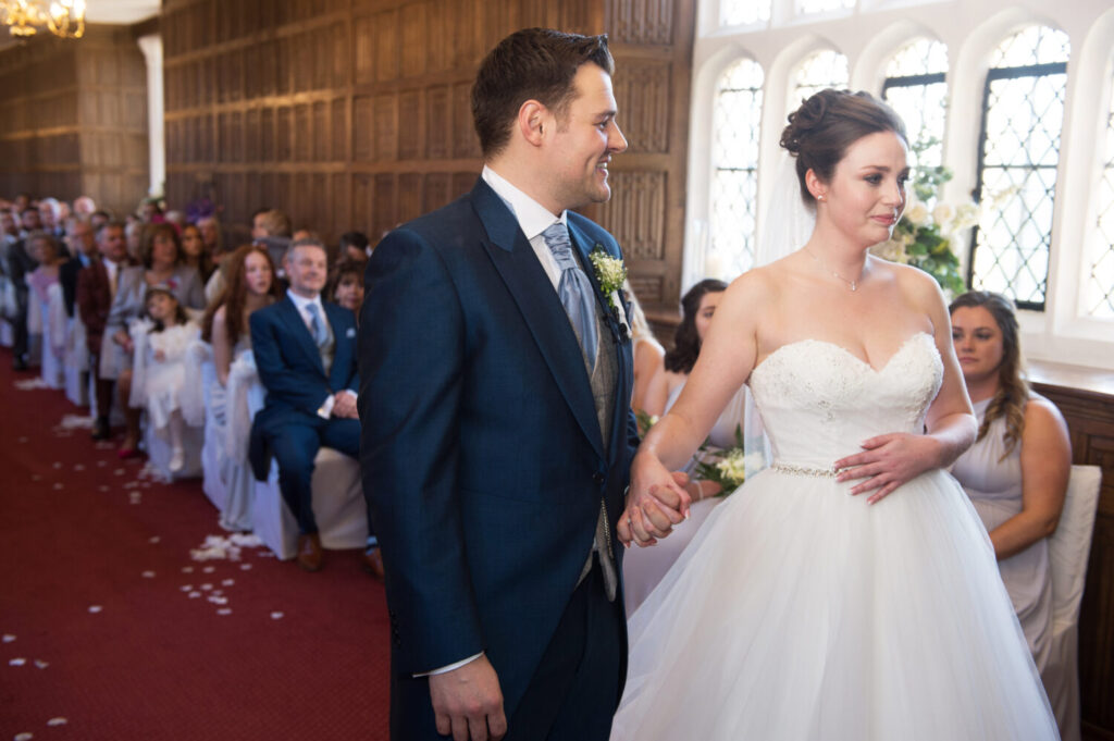 bride and groom at altar