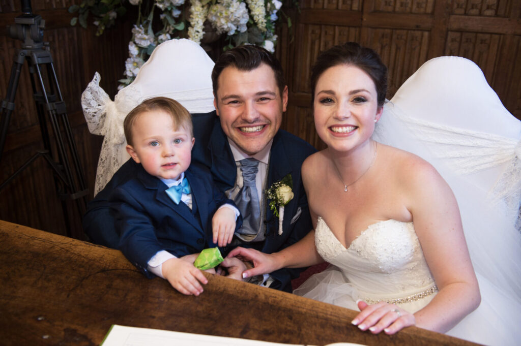 bride groom and page boy, relaxed shot,smiles