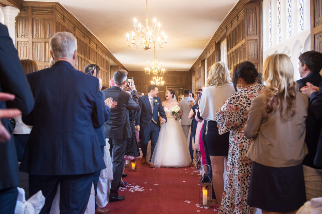 bride and groom leaving the wedding aisle after wedding ceremony