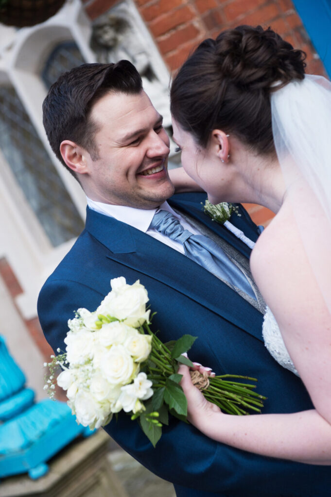 smiling bride and groom