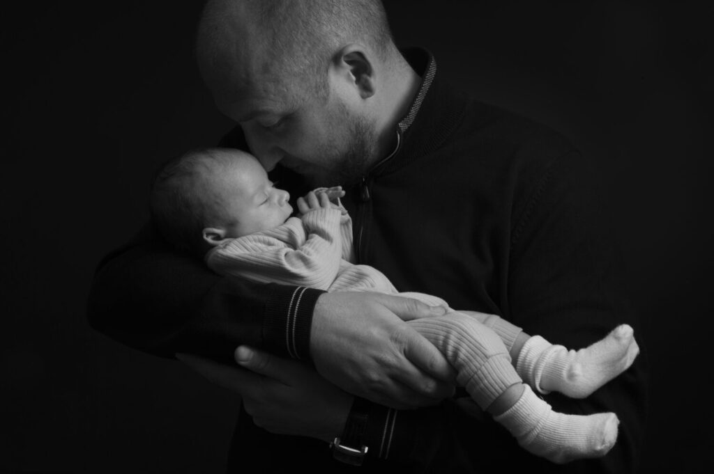 babeinarms, new dad, father's day, patrick photographer, black and white image, father and son, new born baby, studio, hertford photographer, intimate moment, portrait