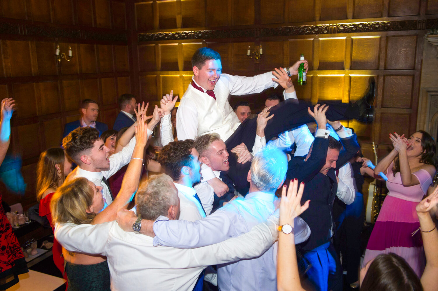 groom on shoulders of guests, party, fun, rowdy